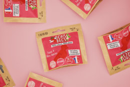 Strawberry and mulberry bonbons in a red and pink package, containing bite-sized candies.