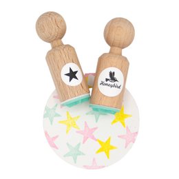 Wooden star-shaped stamp for creative accents and crafts. Features a simple star design that can be used to add decorative elements to various projects.