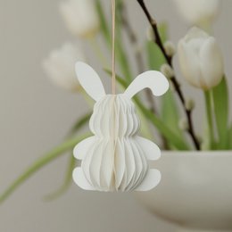  White paper pendant in the shape of a rabbit, perfect for Easter decoration.