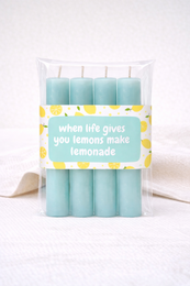  Set of 4 tall cylindrical lemon scent candles, light blue color, inspirational text label, dinner candles.
