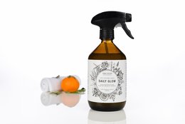 Premium surface cleaner in a 500ml spray bottle with a black trigger. The bottle has a white label with a floral design and the text "DAILY GLOW Premium Surface Cleaner".