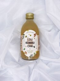 Lime, mint, and ginger flavored kombucha in a 30cl glass bottle.