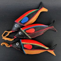  Colorful, stylized fish-shaped coin purses in a pack of 12. Made of durable materials with zipper closures.