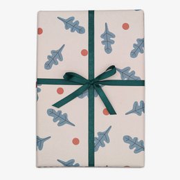 Festive wrapping paper with a repeating pattern of blue and pink holiday-themed shapes, including stars and snowflakes, on a light pink background.