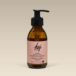 Micellar cleansing water in 150ml bottle. Amber glass bottle with pink label and black pump dispenser. Suitable for all skin types to remove makeup and impurities.