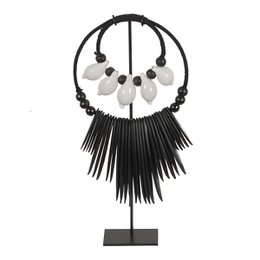  Black and white necklace with octopus-shaped pendant and long black fringe.