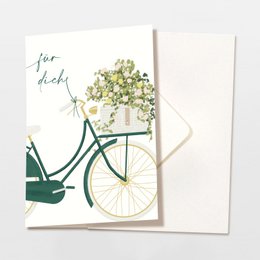 Folding card with envelope featuring the text "Good things are coming" surrounded by purple flowers. The card is FSC certified.