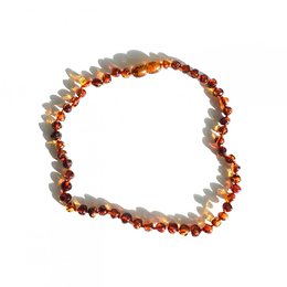 Amber toddler necklace in cognac color, made of natural Baltic amber beads, designed for children's jewelry.