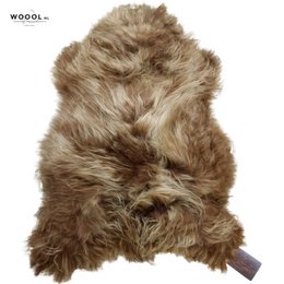 Soft, warm, and cozy Icelandic brown sheepskin throw with a natural, shaggy texture.