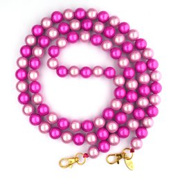  A delicate silver-toned necklace featuring a strand of small, round beads. The necklace has a simple, elegant design that would complement a variety of outfits.