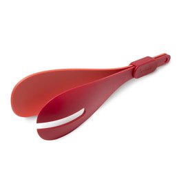 Red plastic salad server with a curved shape and a handle.