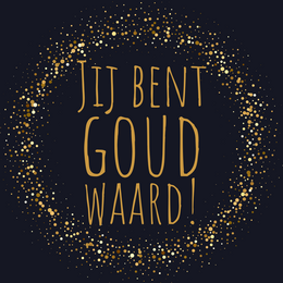 Gold-colored mood light with the text "Je bent goud waard!" (You are worth gold!) on the glass. The light is placed on a gray surface next to a wrapped gift box.