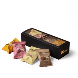 A gift box containing caramel-filled marshmallow treats in various flavors, presented in a sleek black box.