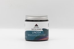 Aloe and prickly pear moisturizing body cream in a glass jar with a green label.