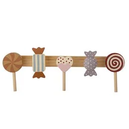 A wooden coat rack with a brown pine finish. The rack features various decorative elements such as spirals, dots, and shapes, creating a unique and stylish design.