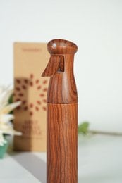 Wooden mist spray bottle for hair care, with a simple and natural design.