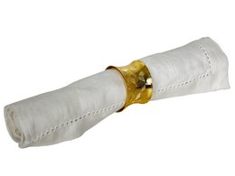  A gold-colored metal napkin holder with a rectangular shape, measuring approximately 5x3x3cm.