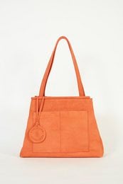 Tangerine-colored suede handbag with two top handles and a front pocket.
