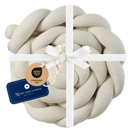 Ivory braided bed bumper, knitted XL, for kids room decorative pillows. Soft, plush material in a braided design to add comfort and style to a child's bed.