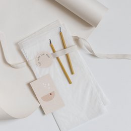 A set of minimalist stickers with the text "Go with the Slow" printed on a neutral-colored background, suitable for a variety of uses.