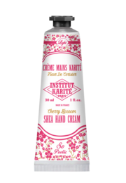 A 30 mL hand cream with a cherry blossom scent, featuring a floral and feminine design.