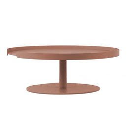 A round, clay-colored cake stand with a raised base. The stand has a simple, minimalist design that would complement a variety of baking and serving needs.