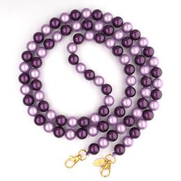  A delicate silver-toned necklace featuring a strand of small, round beads. The necklace has a simple, elegant design that would complement a variety of outfits.