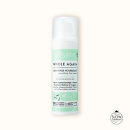 A white, cylindrical cream container with the product name "Whole Again" printed on the label. The cream appears to be a moisturizing or skin care product.