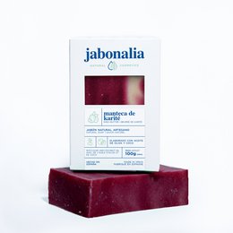 Red, rectangular soap bar with "Jabonalia" branding. Shea butter soap, 100g.