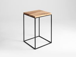 Solid wood side table with a minimalist metal frame design, suitable for use as an end table or nightstand.