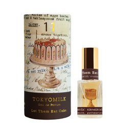 Floral, feminine eau de parfum with notes of rose, peony, and jasmine. Packaged in a glass bottle with a gold cap and floral design.