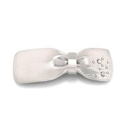  White acrylic and crystal hair barrette with a bow and rhinestone embellishments.
