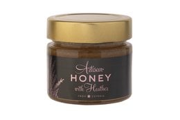 Honey with Heather, a rich and flavorful honey product. The honey is dark in color with a smooth, creamy texture. It has a sweet, floral aroma and taste, with notes of heather.