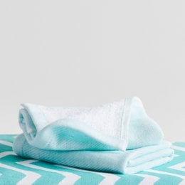 Aqua white cotton hammam terry face towel, soft absorbent textured weave, geometric pattern design.