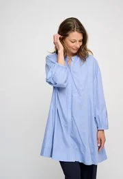 Light blue chambray tunic dress, long sleeves, relaxed fit, button-front, casual women's dress.