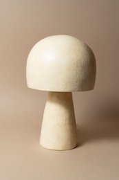  Cream mushroom-shaped table lamp, round dome cap, cylindrical stem, ceramic material, minimalist design, warm ambient lighting.