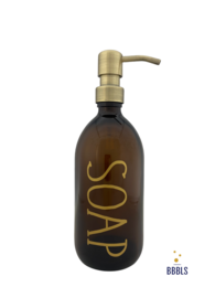 A brown glass soap dispenser with a gold-colored pump and the word "SOAP" printed in premium text. The dispenser has a capacity of 500ml.