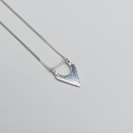 Elegant armature necklace in 14k gold or sterling silver, featuring a delicate pendant with a unique geometric design.