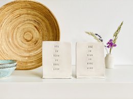 Ceramic card for grandpa or grandma. Decorative object with white card and floral accent.