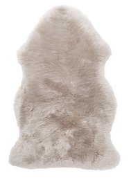 Soft, plush camel-colored lambskin rug for baby's nursery or playroom. Provides a cozy, natural texture and warmth.