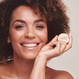 Lip Therapy - A moisturizing lip balm in a compact container, available in various shades to enhance and nourish the lips.