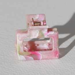  Light pink swirl hair clip, small size, translucent acrylic, decorative hair accessory with swirled design pattern.