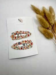 Set of silver and gold hair clips with floral design, suitable for kids.