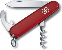  A red Swiss Army Waiter knife with a Victorinox logo and a corkscrew, blade, and other tools.