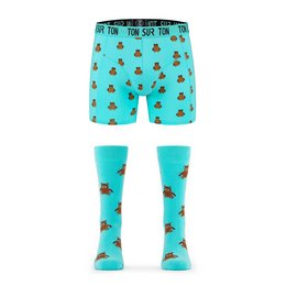Teal blue men's boxer shorts and socks set featuring a repeating teddy bear print pattern. The boxers have a waistband with the text "Teddies for Bettys" printed on it. The socks are a matching teal blue color with the same teddy bear print.