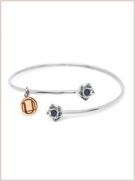  Elegant cuff bracelet with burnished, zaffiro, smeraldo, and rubino colored stones in silver, gold, and burnished finishes.