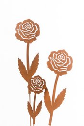 A small 2D rose sculpture made of metal, suitable for garden decor. The rose has a simple, stylized design with a warm, rustic color.