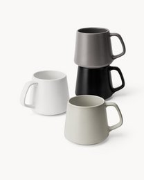  Set of 4 ceramic coffee cups in pastel colors including classic pastel, beige pastel, white, and black. The cups have a simple, minimalist design with a comfortable handle.