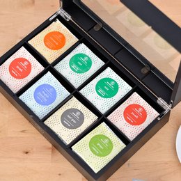 Colorful tea box with 64 organic tea bags, perfect for gifting. Includes a variety of tea flavors in a sleek, modern design.