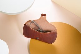 Leather wallet with sunglasses, stylish and functional accessory.